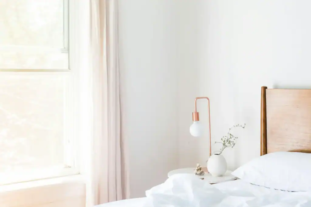 Empty sunlit bedroom corner perfect for setting up a small workout space